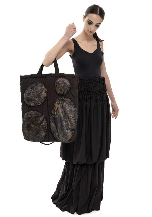 RETENTION FLOWER-TEXTURED BLACK PADDED TOTE BAG