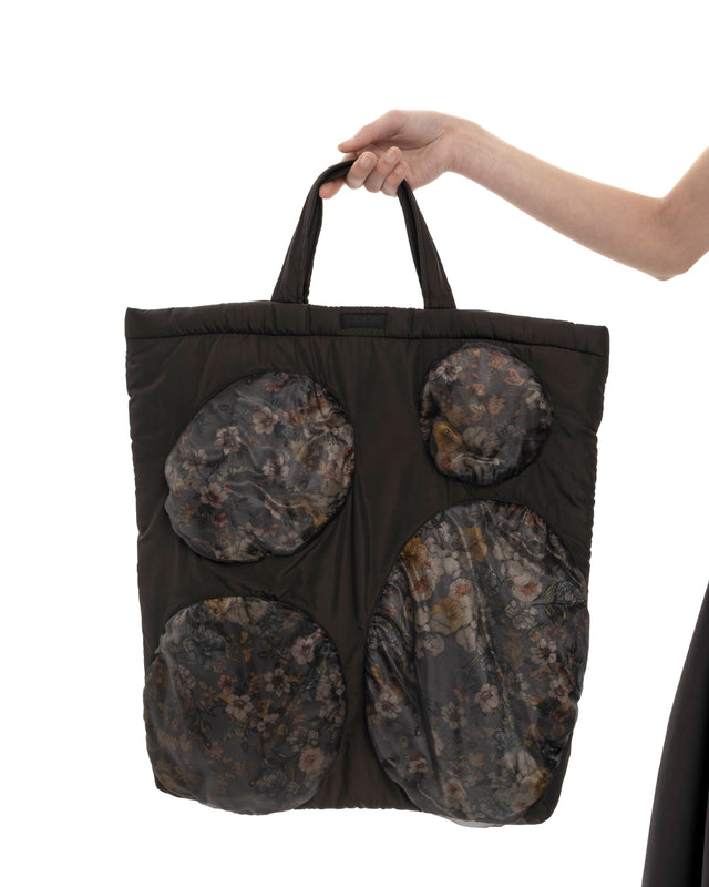 RETENTION FLOWER-TEXTURED BLACK PADDED TOTE BAG
